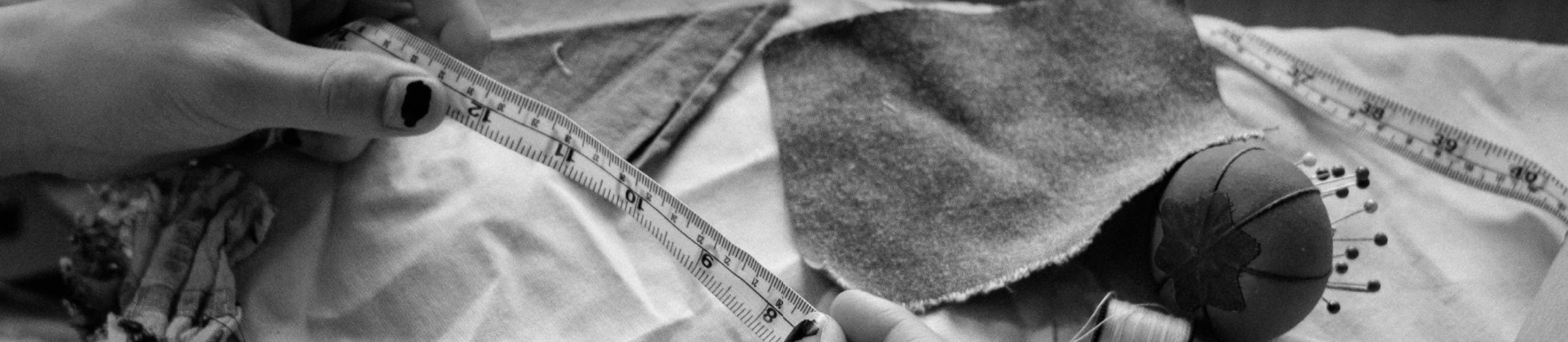 Measuring textile squares in a sewing workspace. <i>(Photo credit: Quan Pham)</i>